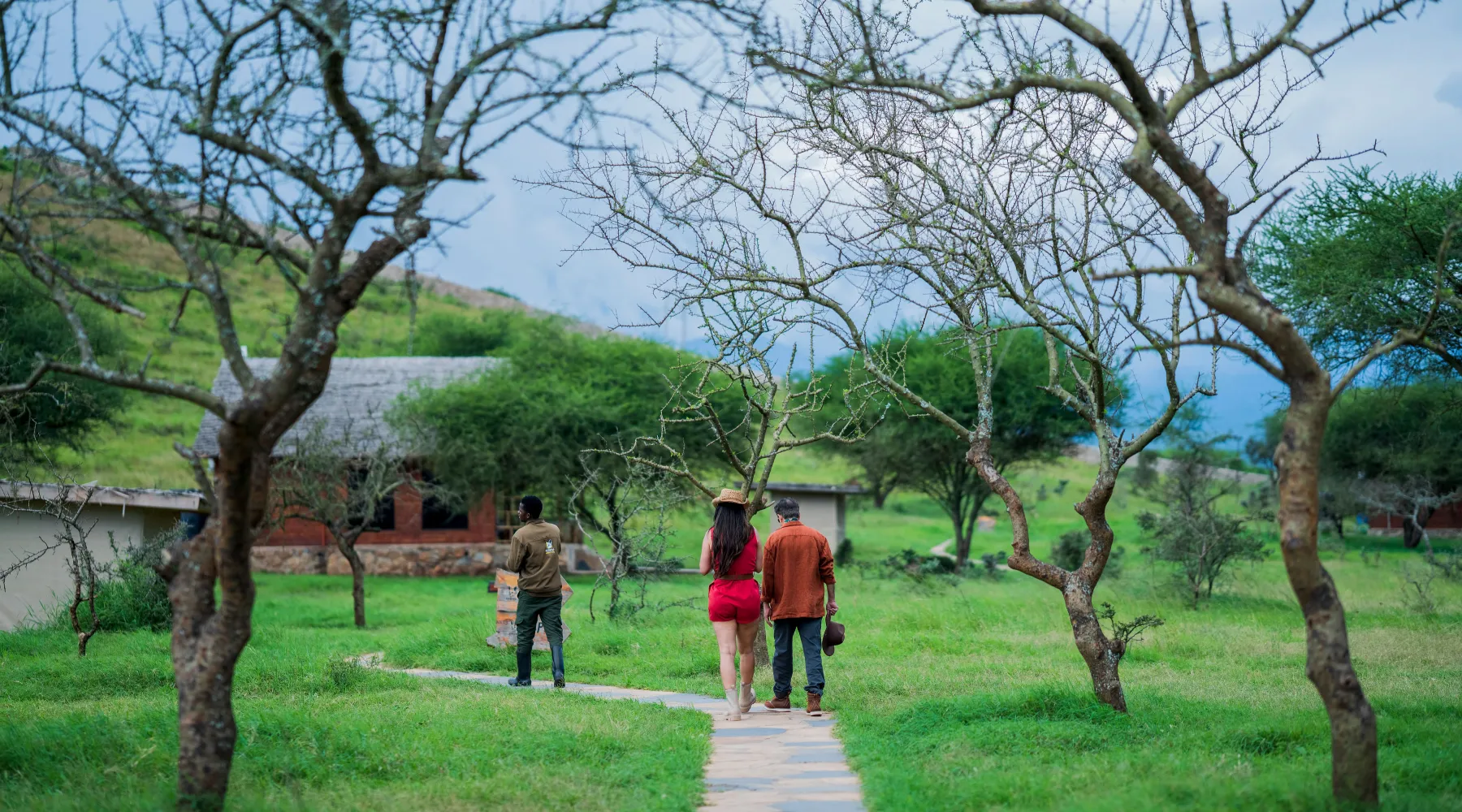 A couple walking through a private safari lodge in Tanzania